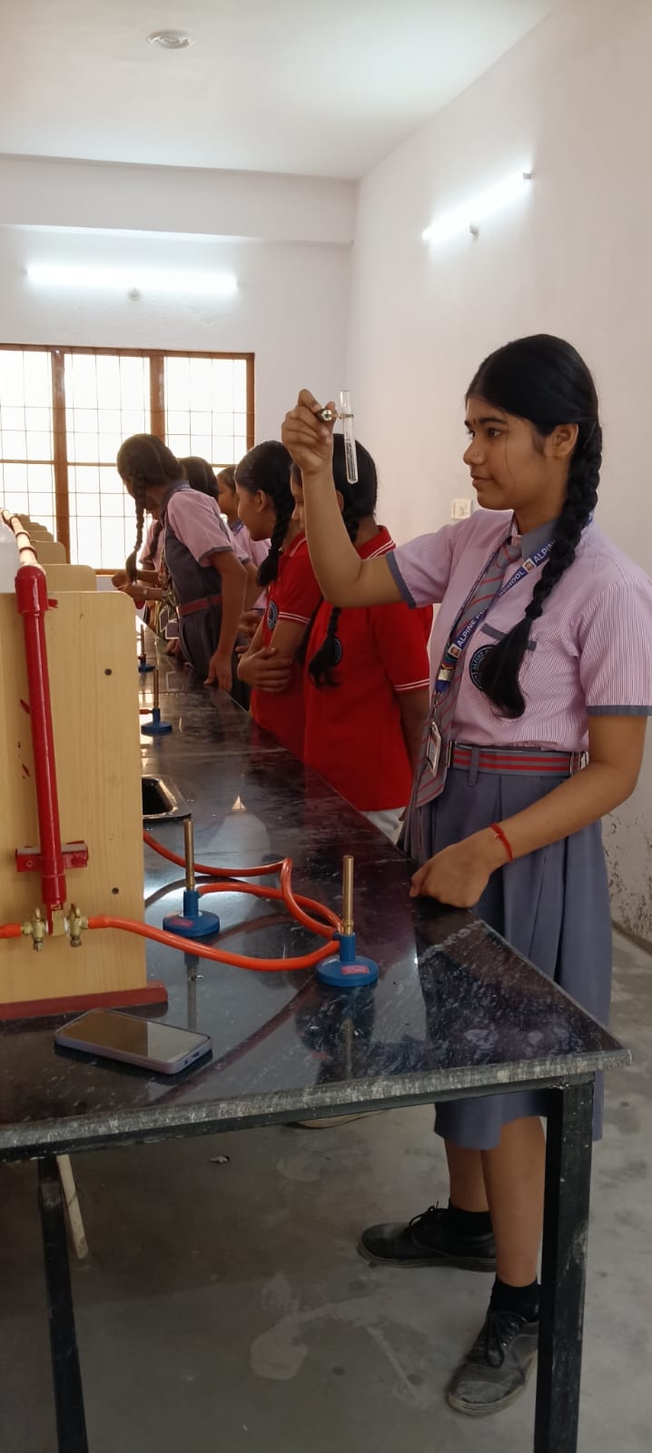 New Science Lab — Student Examining Test Tube