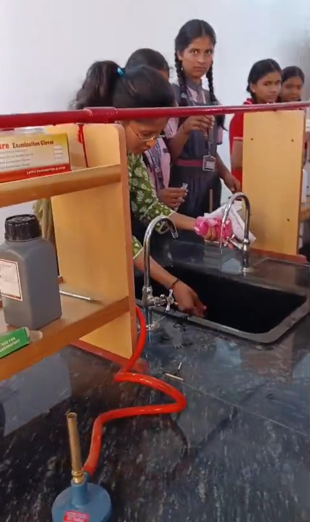 New Science Lab — Teacher Demonstrating at Sink Station